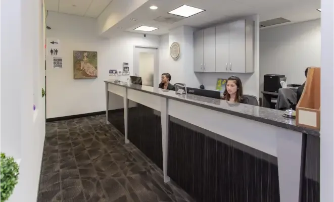 The DC Dental Spa reception desk with team members ready to assist patients