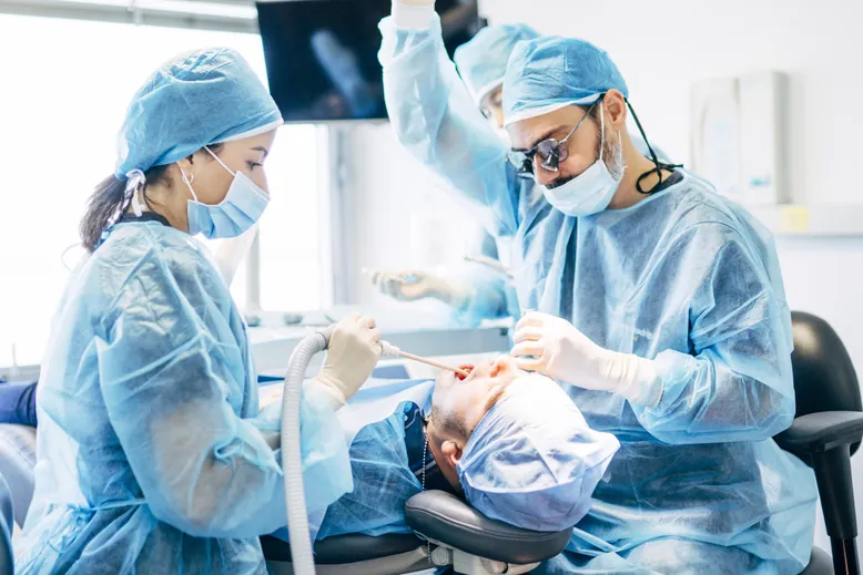 Dental team providing gentle treatment in the clinic