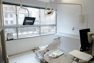 A bright treatment room at DC Dental Spa with a window view