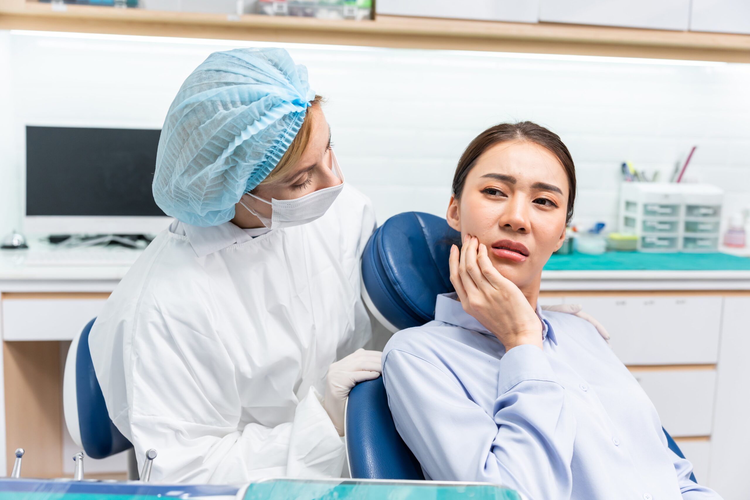 Dentist examine tooth for young girl at dental health clinic.