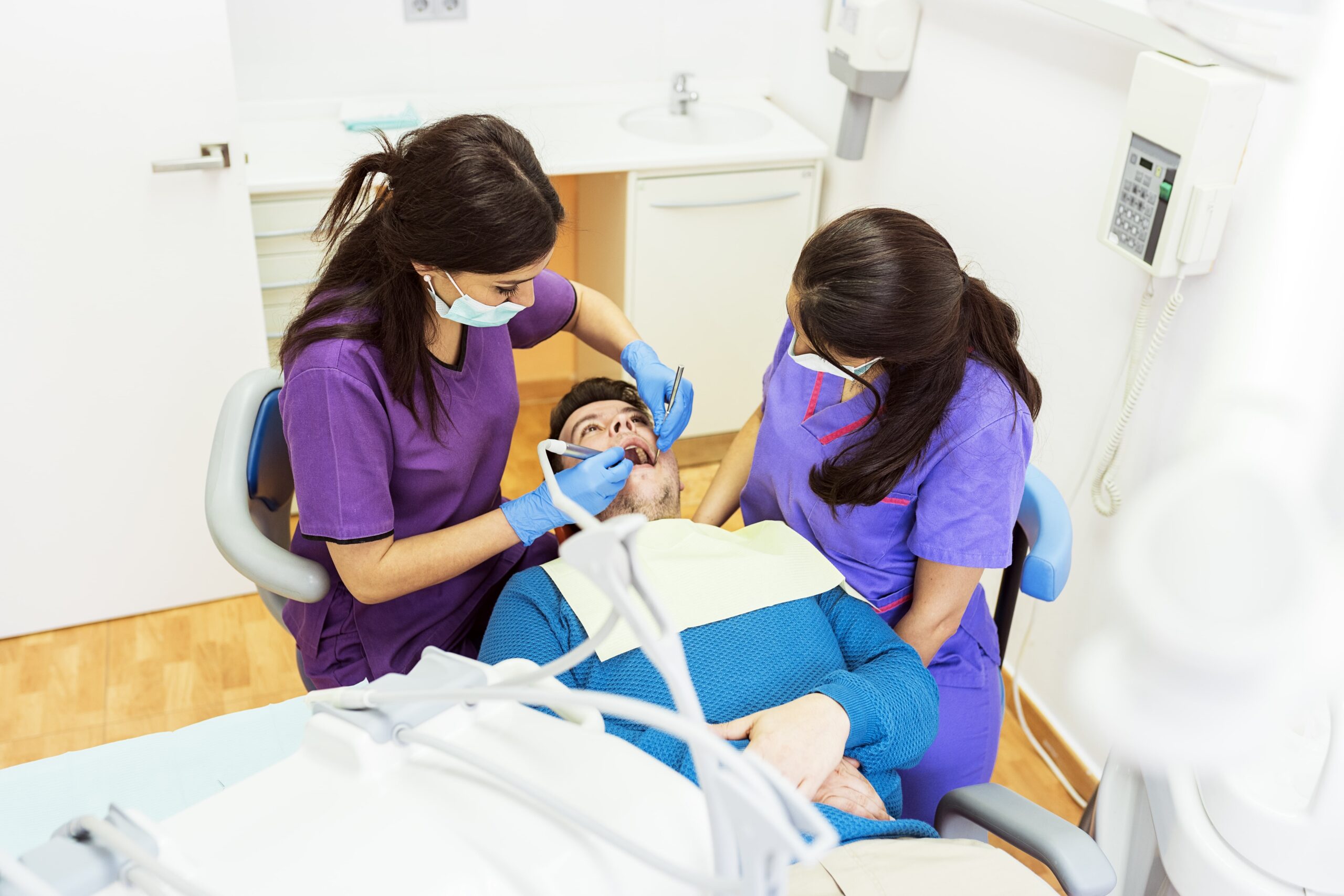Dentists working in dental clinic.